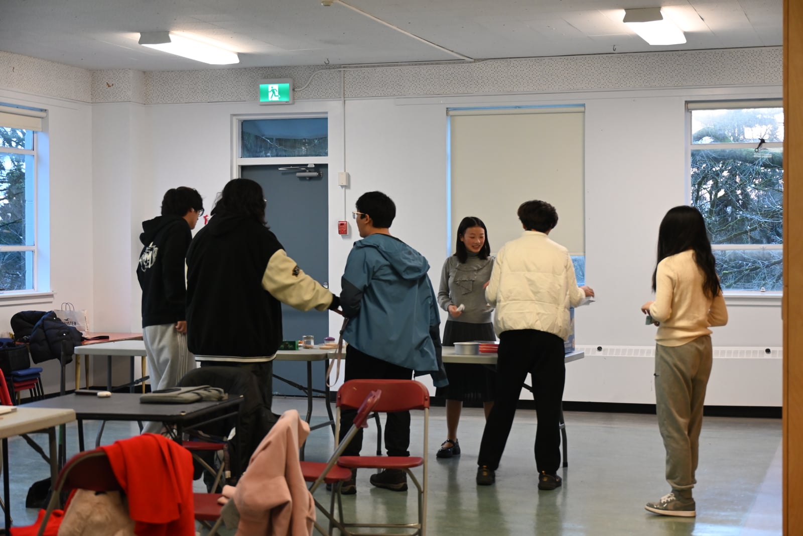 Participants gathering for the Open Arms cultural food exchange