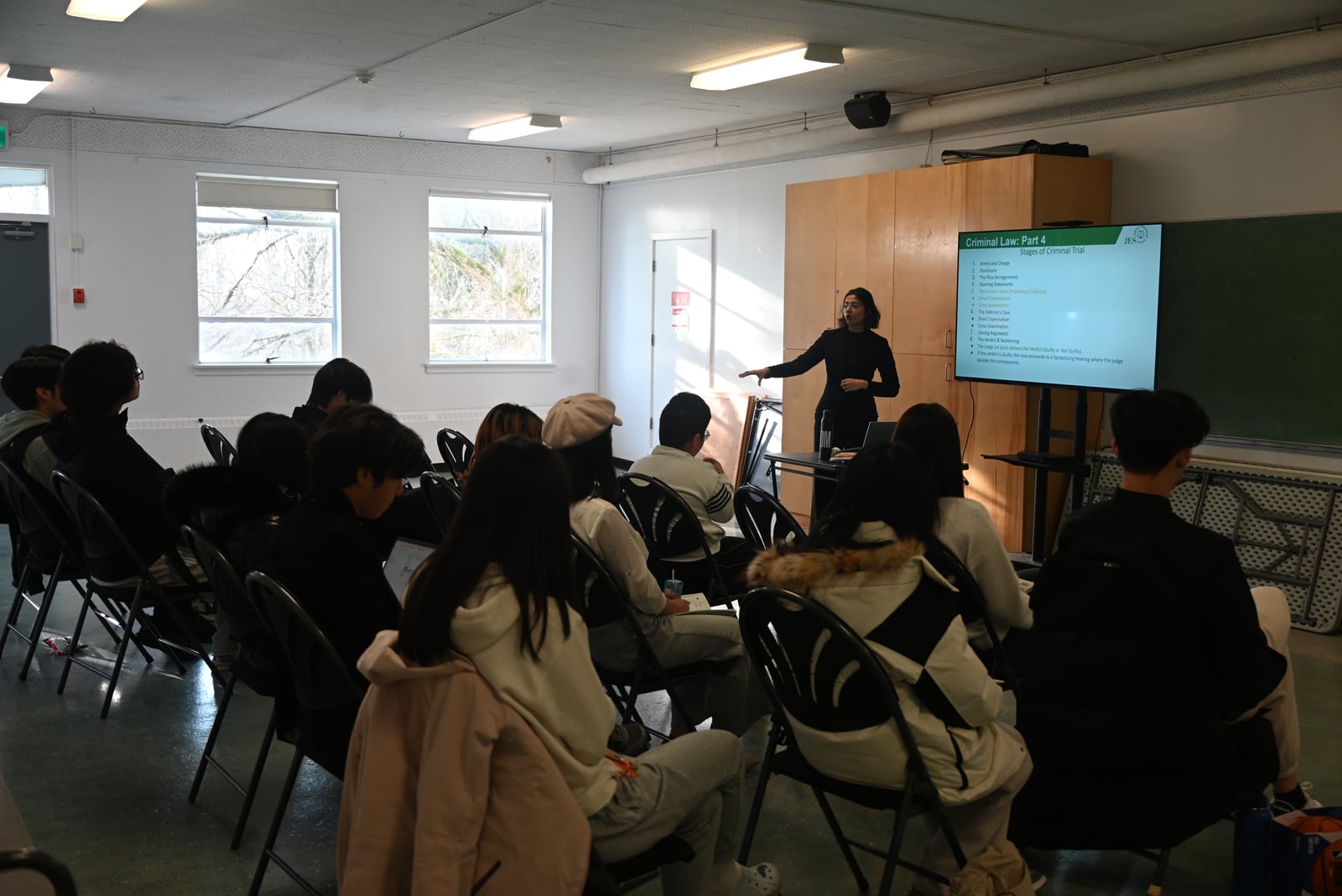 A workshop leader speaking to participants at the Open Arms mock trial