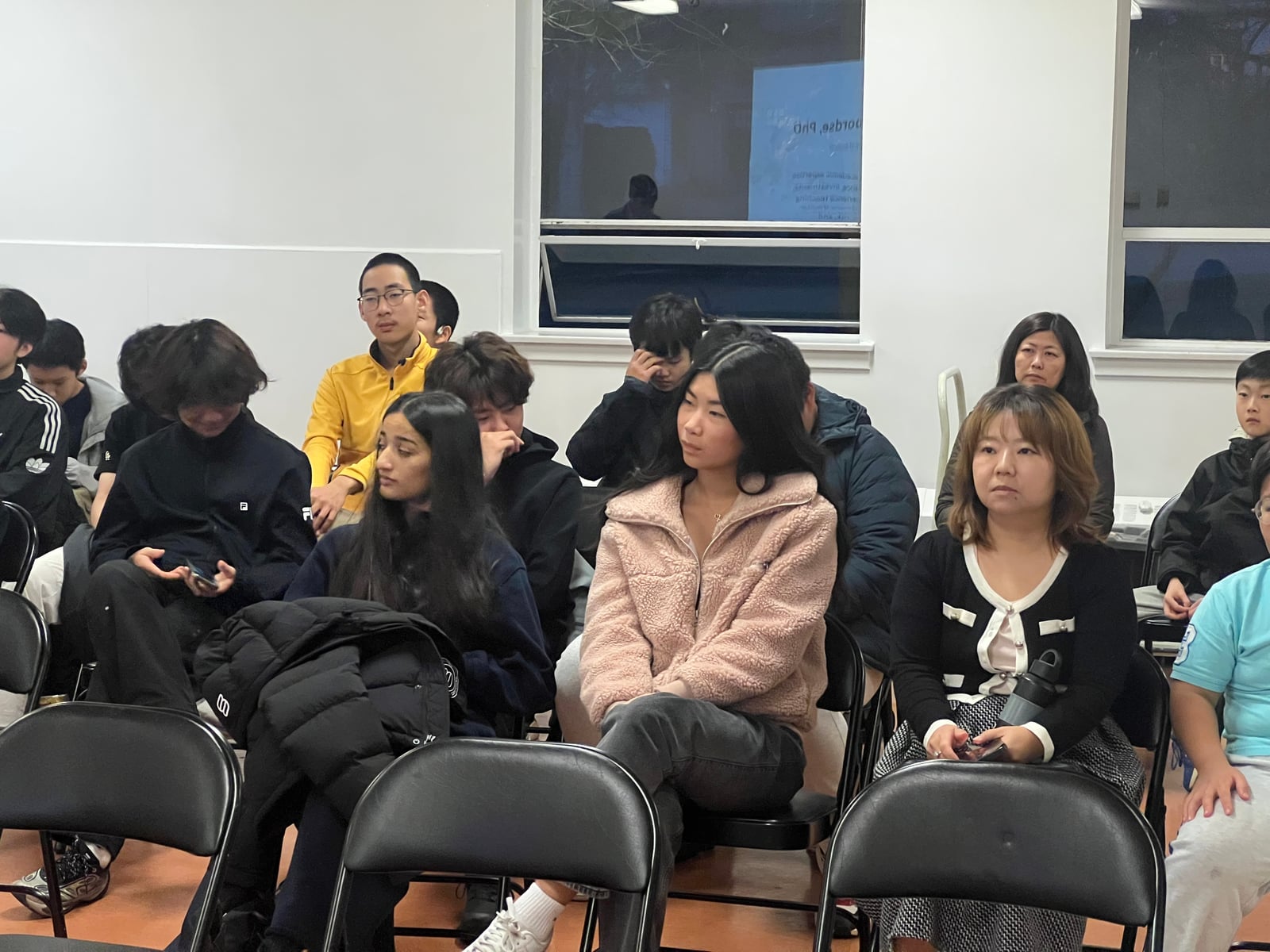 Audience members following a discussion at Striders EDU