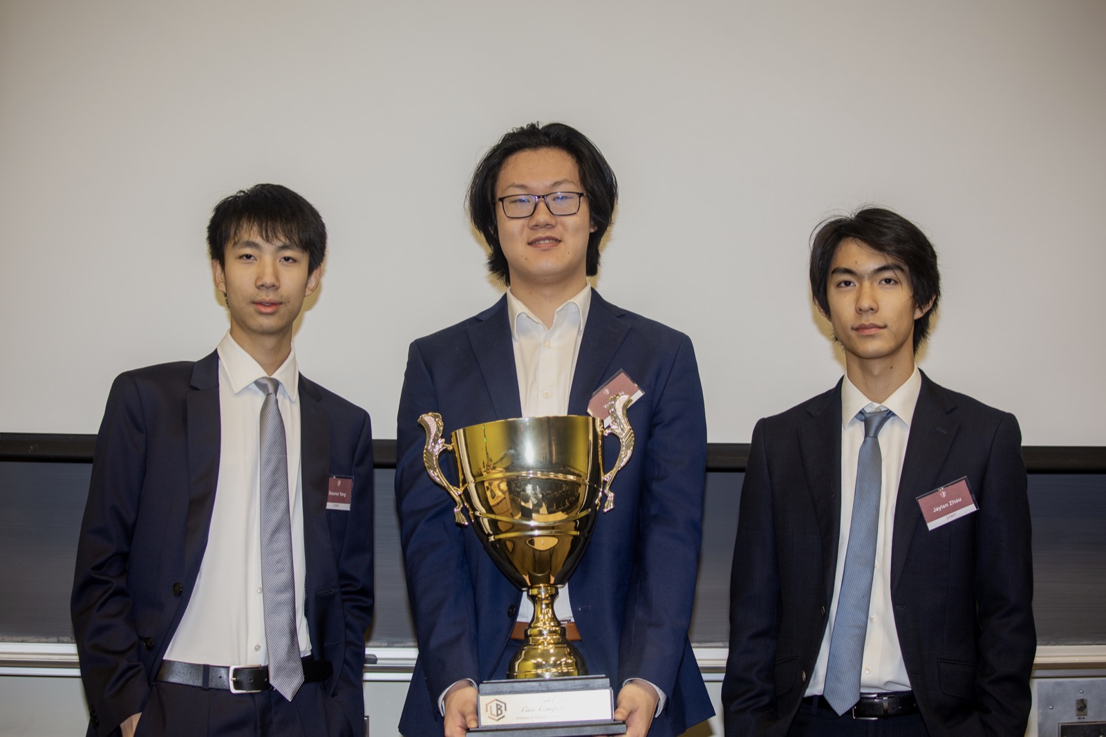 The winning team holding the trophy at the Lord Byng Case Competition