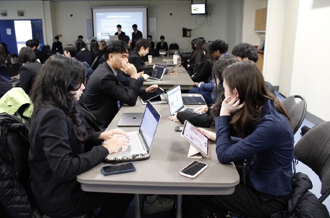Student teams working together during the INSPIRE Case Competition